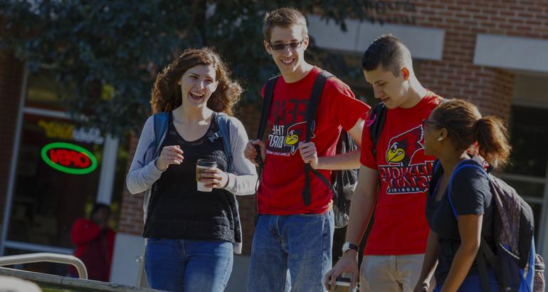 Students laughing as they walk to class.